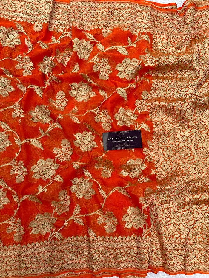 KHADDI GEORGETTE BIG FLORAL JAAL WATER ZARI SAREE - ORANGE