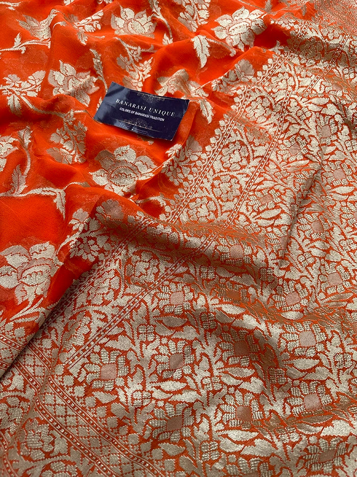 KHADDI GEORGETTE BIG FLORAL JAAL WATER ZARI SAREE - ORANGE