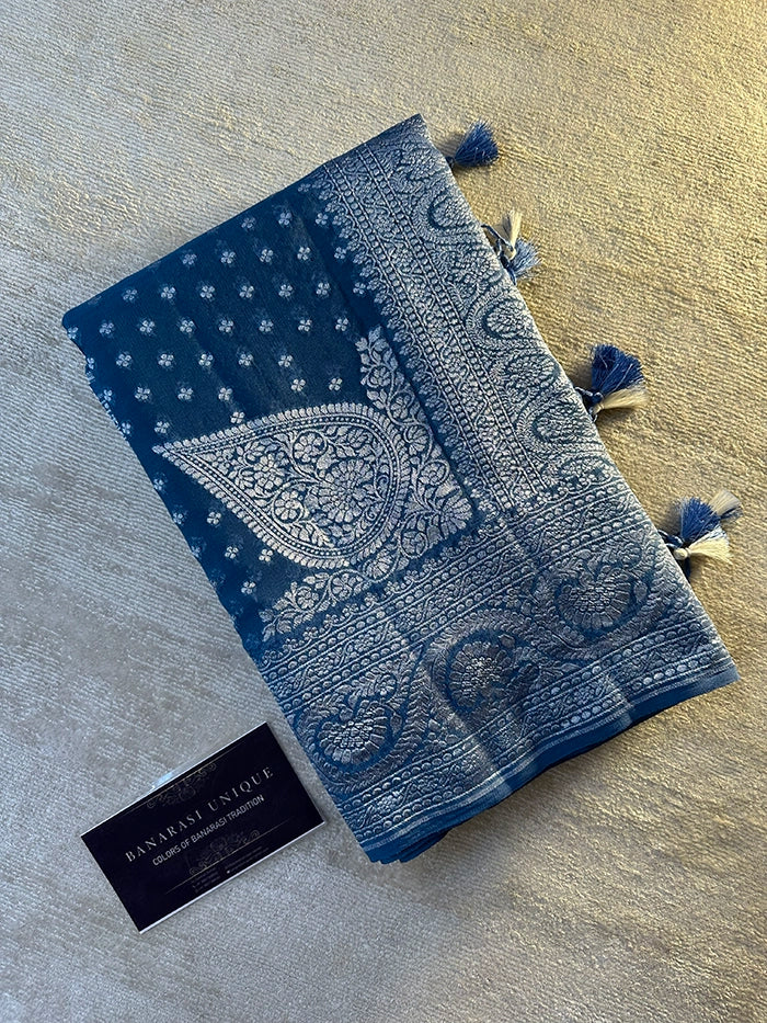 KHADDI GEORGETTE KONIA FOUR-PETAL BUTI SILVER ZARI SAREE - BERMUDA BLUE