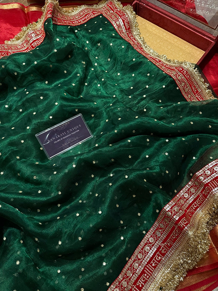 SAUBHAGYAWATI HAND EMBROIDERED TISSUE SAREE - BOTTLE GREEN with RED BORDER
