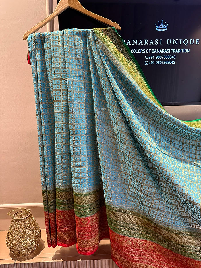 KHADDI GEORGETTE MULTICOLOUR 3D SAREE - SKY BLUE BODY RED BORDER
