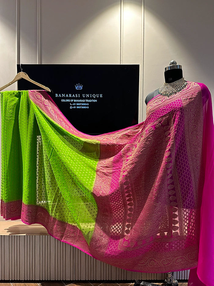 KHADDI GEORGETTE KONIA FOUR-PETAL BUTI ANTIQUE ZARI SAREE - CONTRAST BORDER PARROT GREEN WITH DEEP PINK