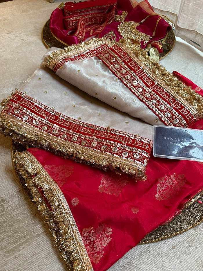 SAUBHAGYAWATI HAND EMBROIDERED TISSUE SAREE - SILVER WHITE with RED BORDER