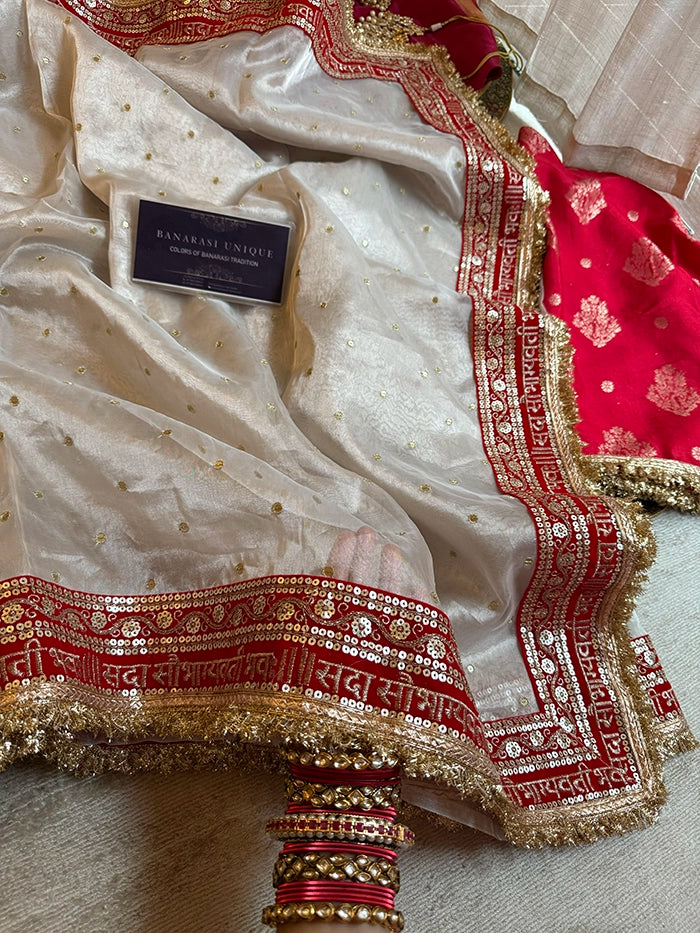 SAUBHAGYAWATI HAND EMBROIDERED TISSUE SAREE - SILVER WHITE with RED BORDER